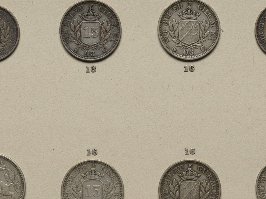 Perubahan posisi mintmark pada desain koin